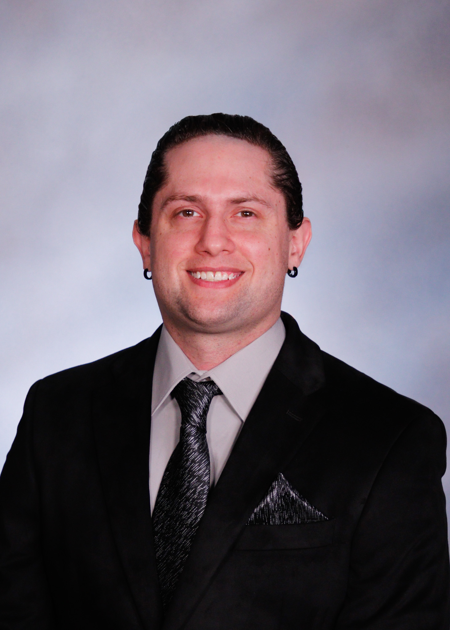 Professional portfolio headshot of Daniel Wade Heatherly in a suit